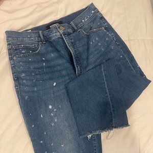 blue express mom jeans with paint splatter